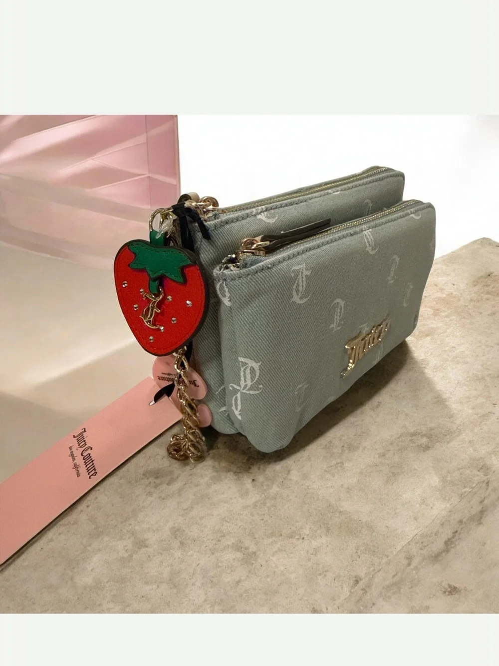 Juicy Couture light denim Monogram Canvas Wristlet with strawberry charm